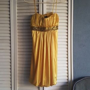 Yellow rhinestone cocktail dress.